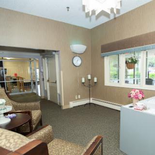 A cozy lobby area featuring comfortable seating and ample natural light.