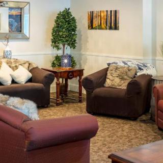 Cozy living room with comfortable seating and warm decor.
