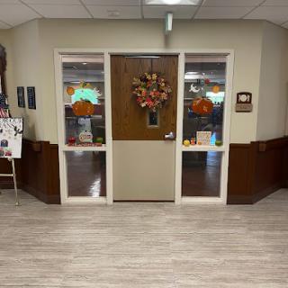 A welcoming entrance adorned with autumn decorations.