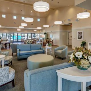 A spacious and cozy lobby area with modern furniture and elegant lighting.