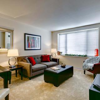 A modern living room with cozy seating and stylish decor.