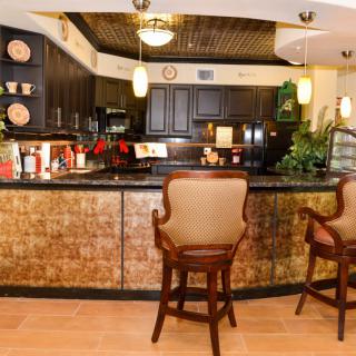 A cozy home bar with wooden accents and comfortable seating.