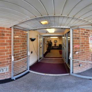 A welcoming entrance leading into a well-lit hallway.
