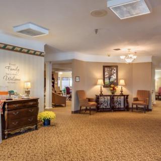 A warmly decorated lobby area with comfortable seating and elegant furnishings.
