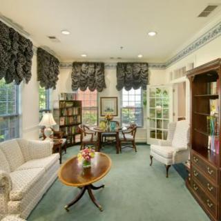 A cozy living room with traditional furnishings and elegant decor.