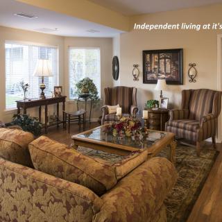 A cozy living room with elegant furniture and warm lighting.