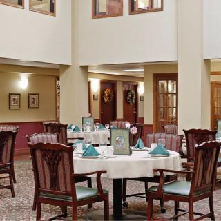 Elegant dining area with neatly arranged tables and classic decor.