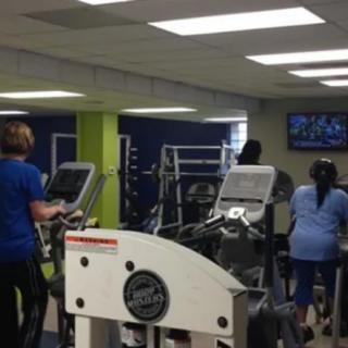 People working out on treadmills in a gym.