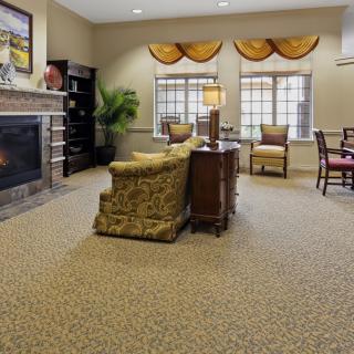 A cozy living room with a fireplace and elegant furniture.