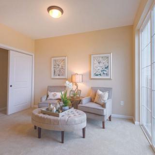 A cozy living room with elegant furniture and soft lighting.