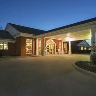 A well-lit building entrance at night.