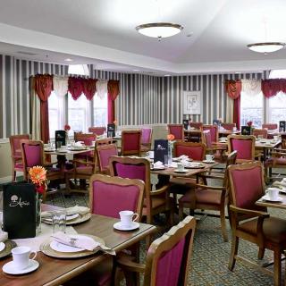 Elegant dining room with neatly arranged tables and chairs.