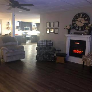 Cozy living room with a fireplace and comfortable seating.