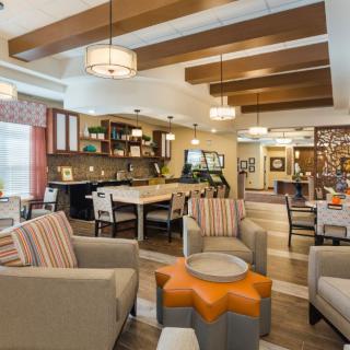 A modern and cozy living room with comfortable seating and stylish lighting.