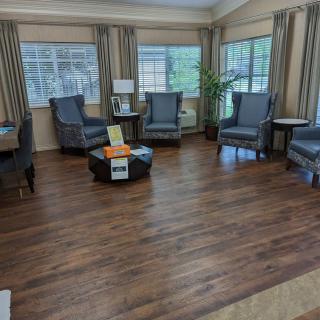 A cozy living room with comfortable chairs and ample natural light.