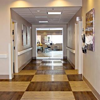 A well-lit hospital hallway showing a clean and organized environment.