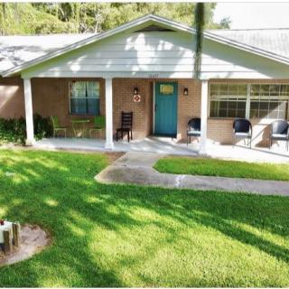 A cozy house with a well-maintained front lawn and a welcoming porch.
