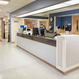 A hospital reception area with a clean and modern design.