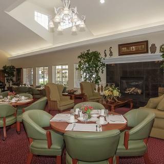A cozy dining area with elegant seating and ambient lighting.