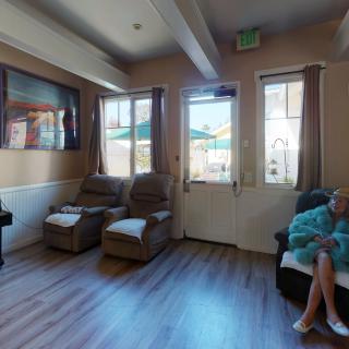 A cozy living room with comfortable seating and large windows.