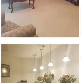 A cozy living room and dining area with elegant furniture and soft lighting.