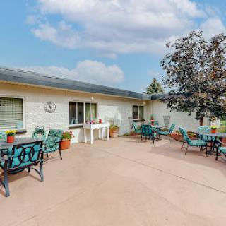 A cozy outdoor patio featuring seating arrangements for relaxation and social gatherings.