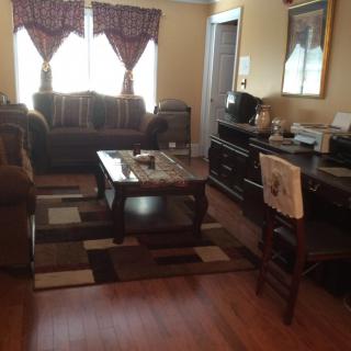 A cozy living room with a sofa, coffee table, and decorative elements.