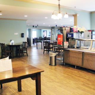 A spacious and casual dining area with a buffet setup.