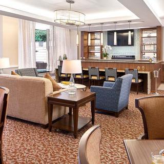 A modern living room with comfortable seating and elegant decor.