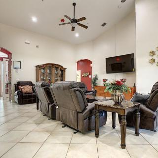 Spacious living room with comfortable seating and modern decor.