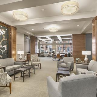 A modern lobby featuring comfortable seating and elegant lighting.