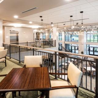 A modern lounge area with comfortable seating and ample natural light.