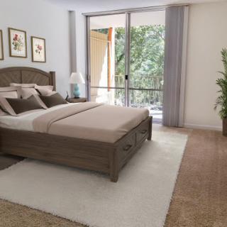 A serene modern bedroom featuring a comfortable bed and natural light streaming in from large windows.