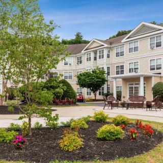 A landscaped garden in front of a residential building.