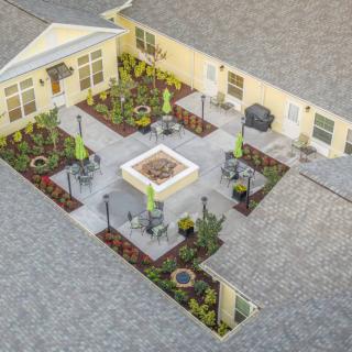 Aerial view of a landscaped courtyard with plants and seating areas.