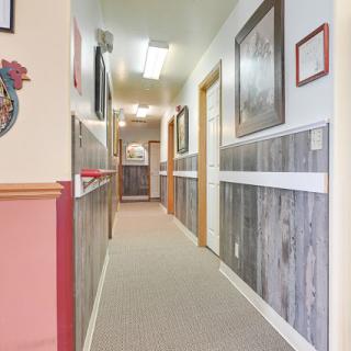 A well-lit hallway featuring decorative elements and a warm, inviting atmosphere.