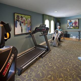 A small fitness room equipped with treadmills and exercise machines.