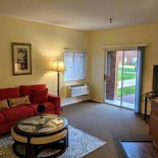 Cozy living room with a red sofa and modern decor.