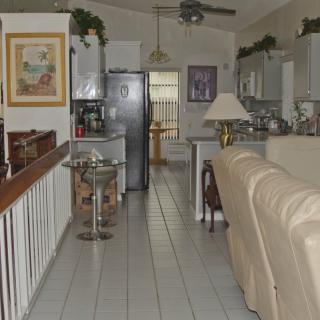 A cozy kitchen and living area with modern amenities and comfortable furnishings.