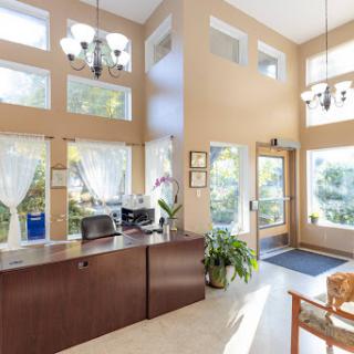 A bright and welcoming lobby area featuring modern furnishings and ample natural light.