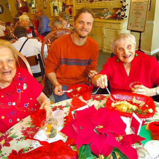 A joyful group having a festive meal together.