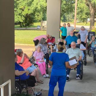 Seniors participating in a community event outdoors.