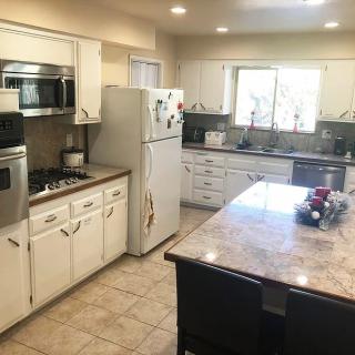 A spacious kitchen with modern appliances and a central island.