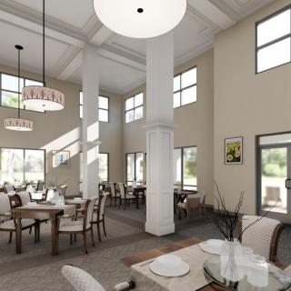 A spacious dining area featuring modern decor, large windows, and elegant chandeliers.