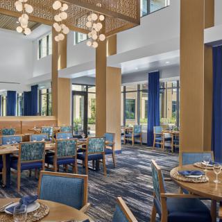 A modern restaurant dining area with elegant decor and lighting.