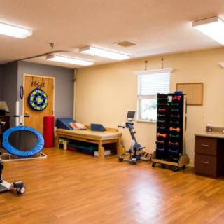 A therapy room equipped with exercise and rehabilitation tools.