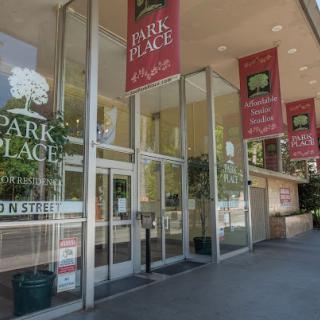The entrance to Park Place, featuring prominent signage and glass doors.
