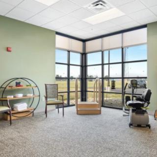 A bright and inviting office waiting area with large windows.