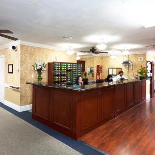 A welcoming lobby area with a reception desk and staff.