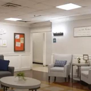 A cozy waiting room with comfortable seating and modern decor.